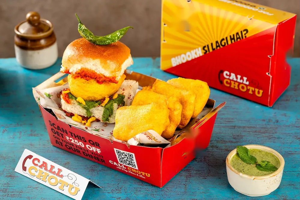 Individual high tea box with vada pav and paneer pakoras