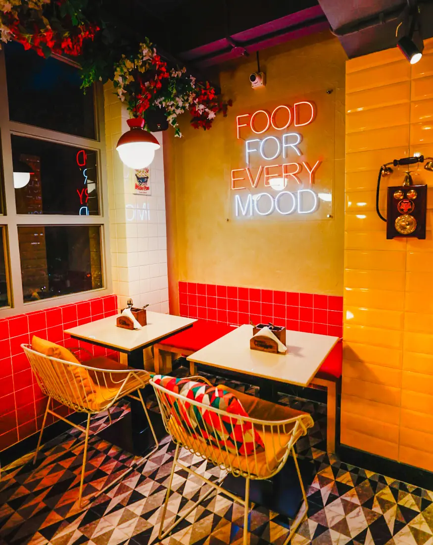 Food for every mood neon in the Saket diner